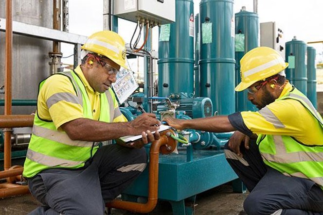two men working on site